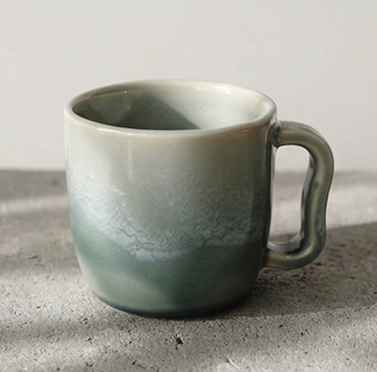 White and blue ombre glazed porcelain mug with a curved handle Ceramics By Marla
